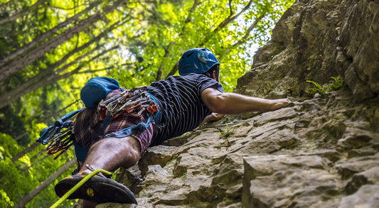 man rock climbing